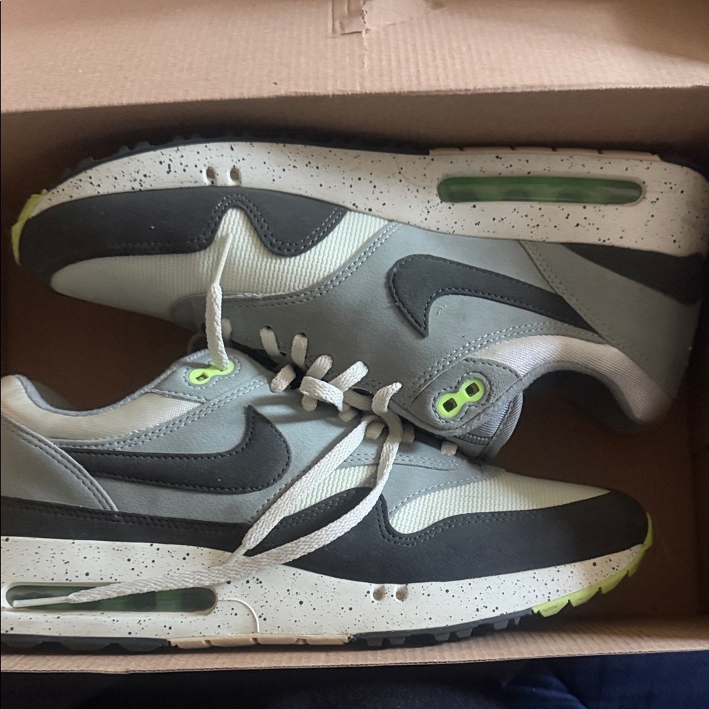 Nike Air Max Men’s Grey and Black Sneakers with Lime Accents fit a little snug.